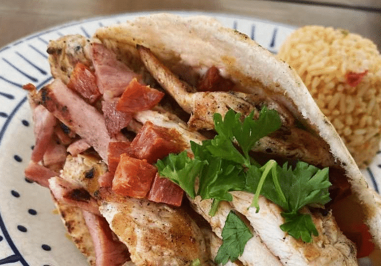 Gourmet chicken and bacon on a white plate